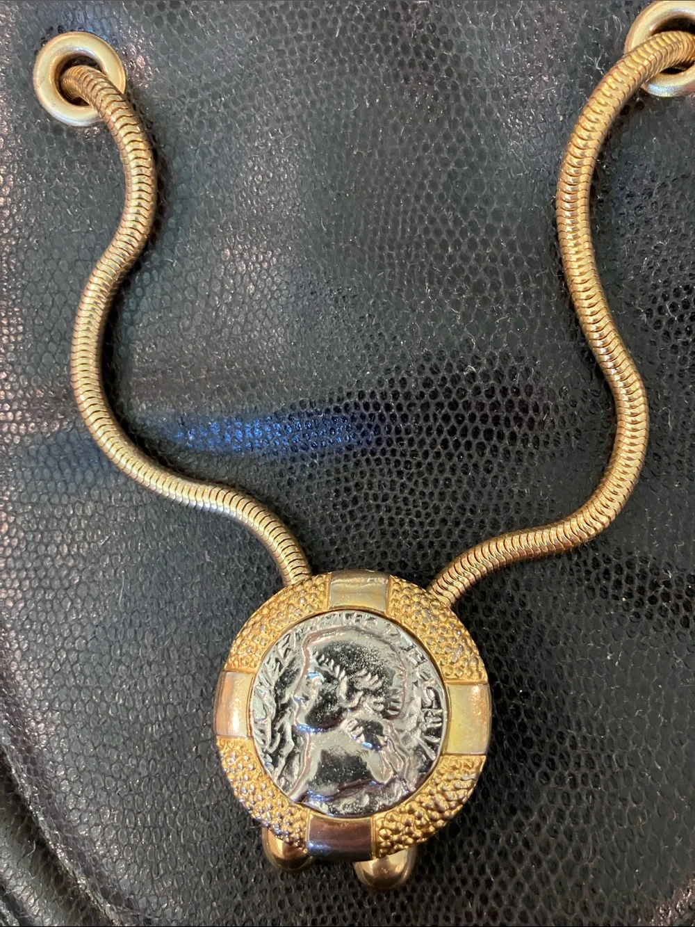 Rodo vintage Black Leather bucket Bag with Gold Medallion Accent